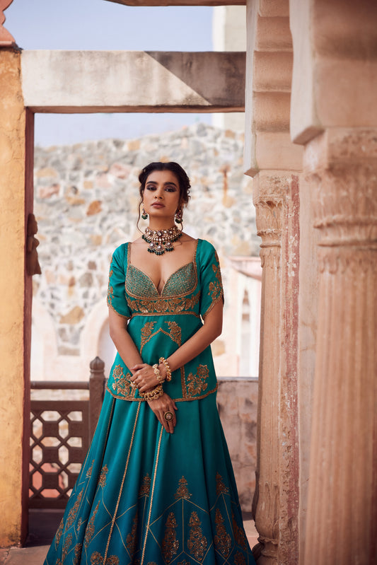 Teel turquise ombre satin georgette lehnga with organza dupatta and satin georgette embroidered long blouse.