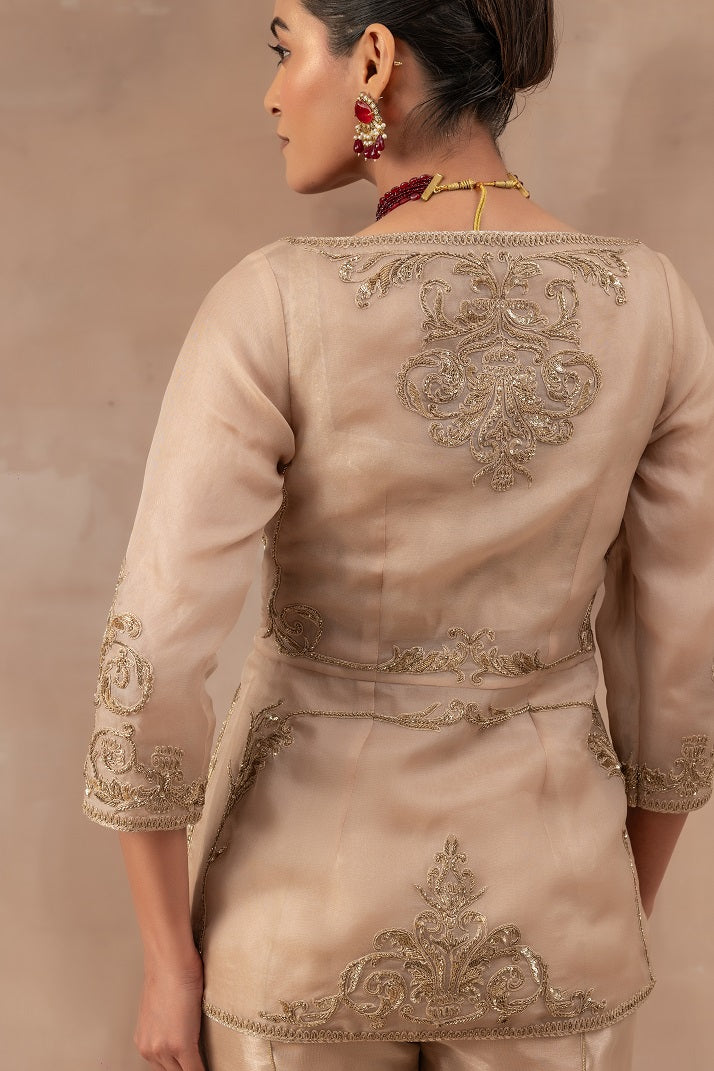 Beige gold silk bustier set with flare tissue flare panel pants and organza jacket