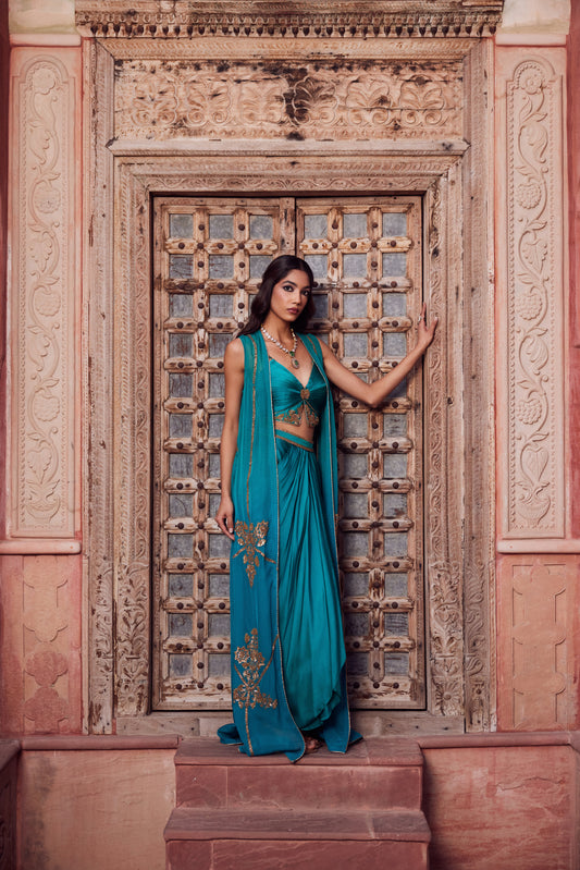 Teel turquise ombre organza georgette cape set with rooshing teel bustier and satin georgette drape skirt.