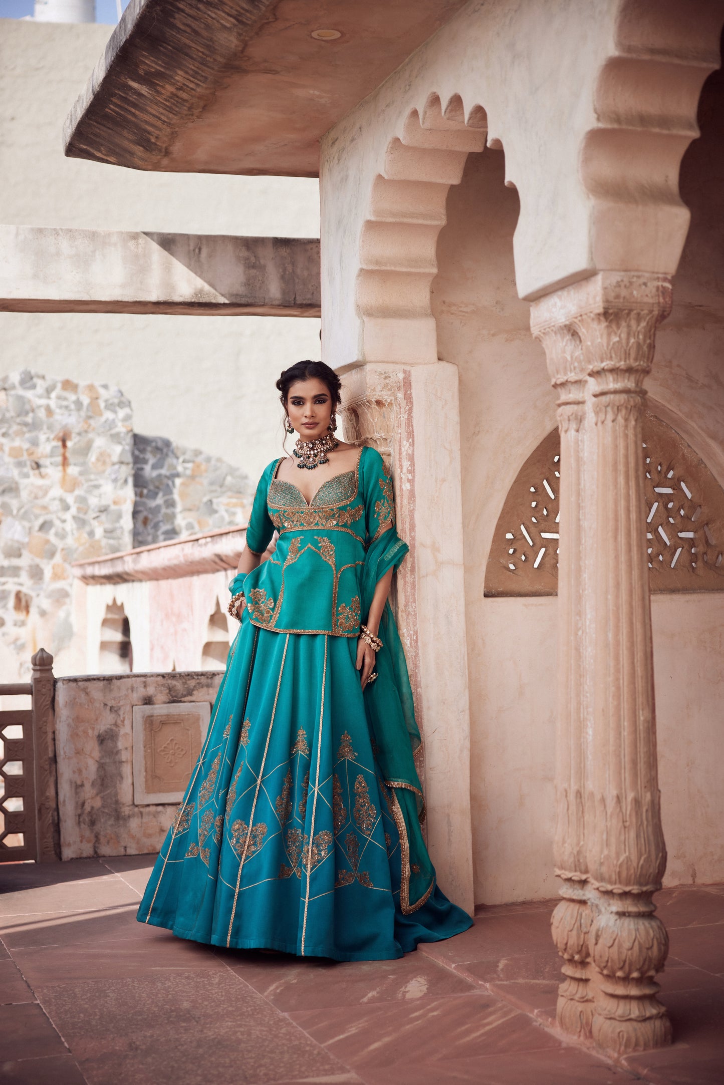 Teel turquise ombre satin georgette lehnga with organza dupatta and satin georgette embroidered long blouse.