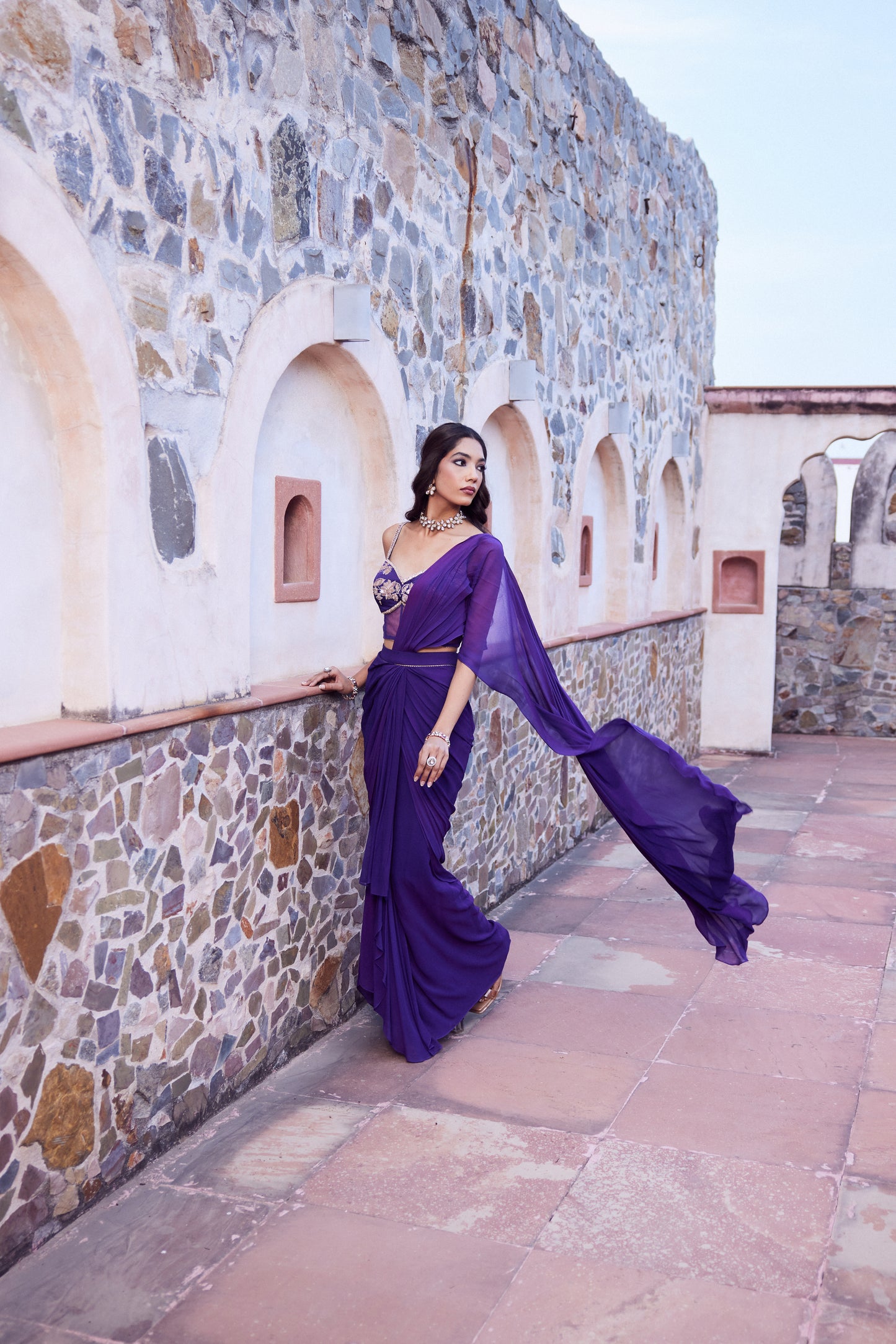 Purple ombre georgette pre stitched drape sari with a corset blouse in satin georgette.