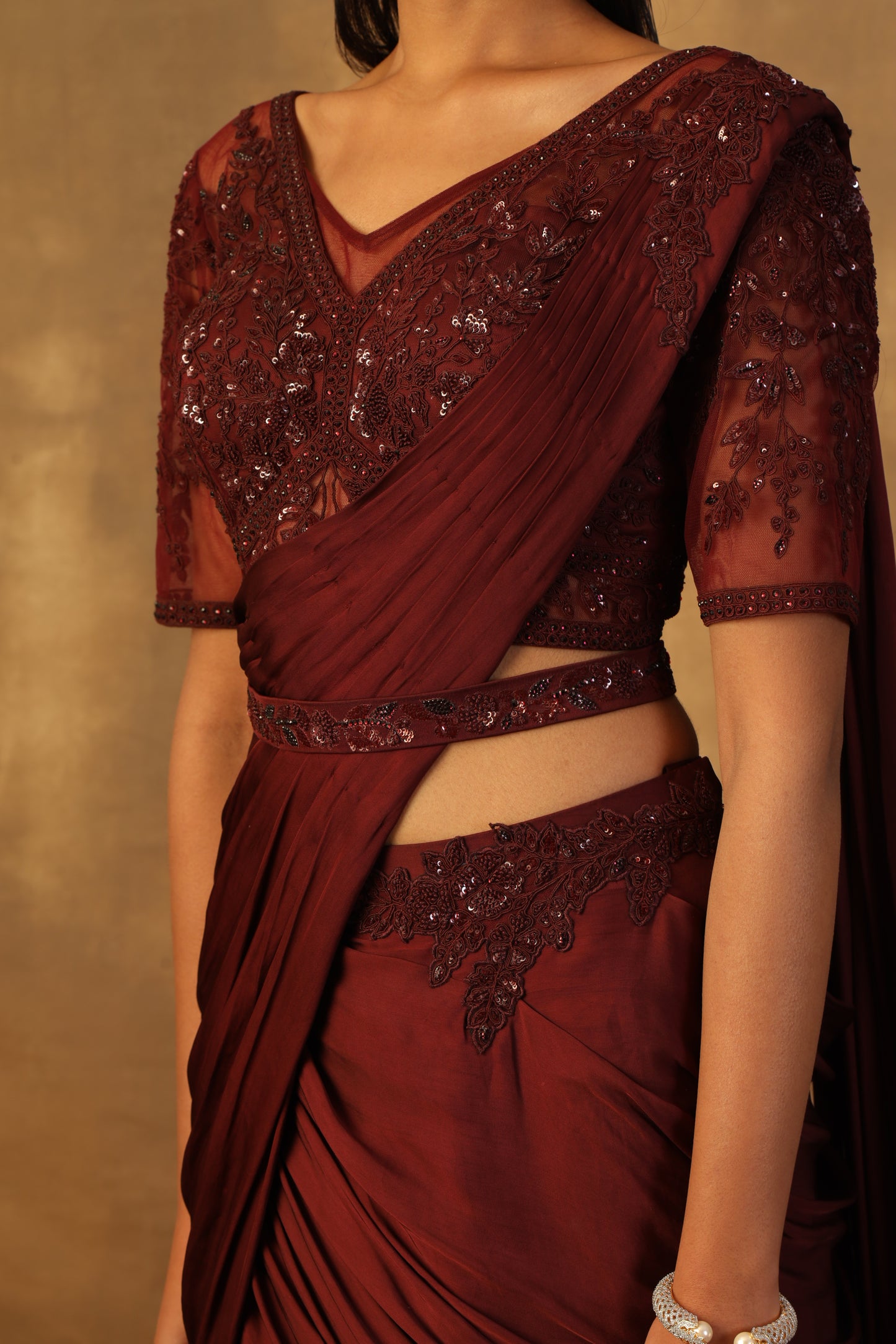 Wine drape lehnga sari with net blouse embroidered with dori and sequins