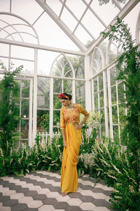 Silk blouse with asymetrical neck and waist line embroidered with multi colour thread