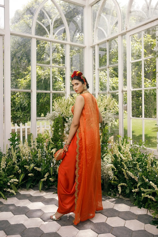 Silk blouse with silk tissue cape and irish satin drape skirt.