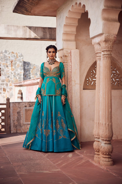 Teel turquise ombre satin georgette lehnga with organza dupatta and satin georgette embroidered long blouse.