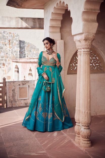 Teel turquise ombre satin georgette lehnga with organza dupatta and satin georgette embroidered long blouse.