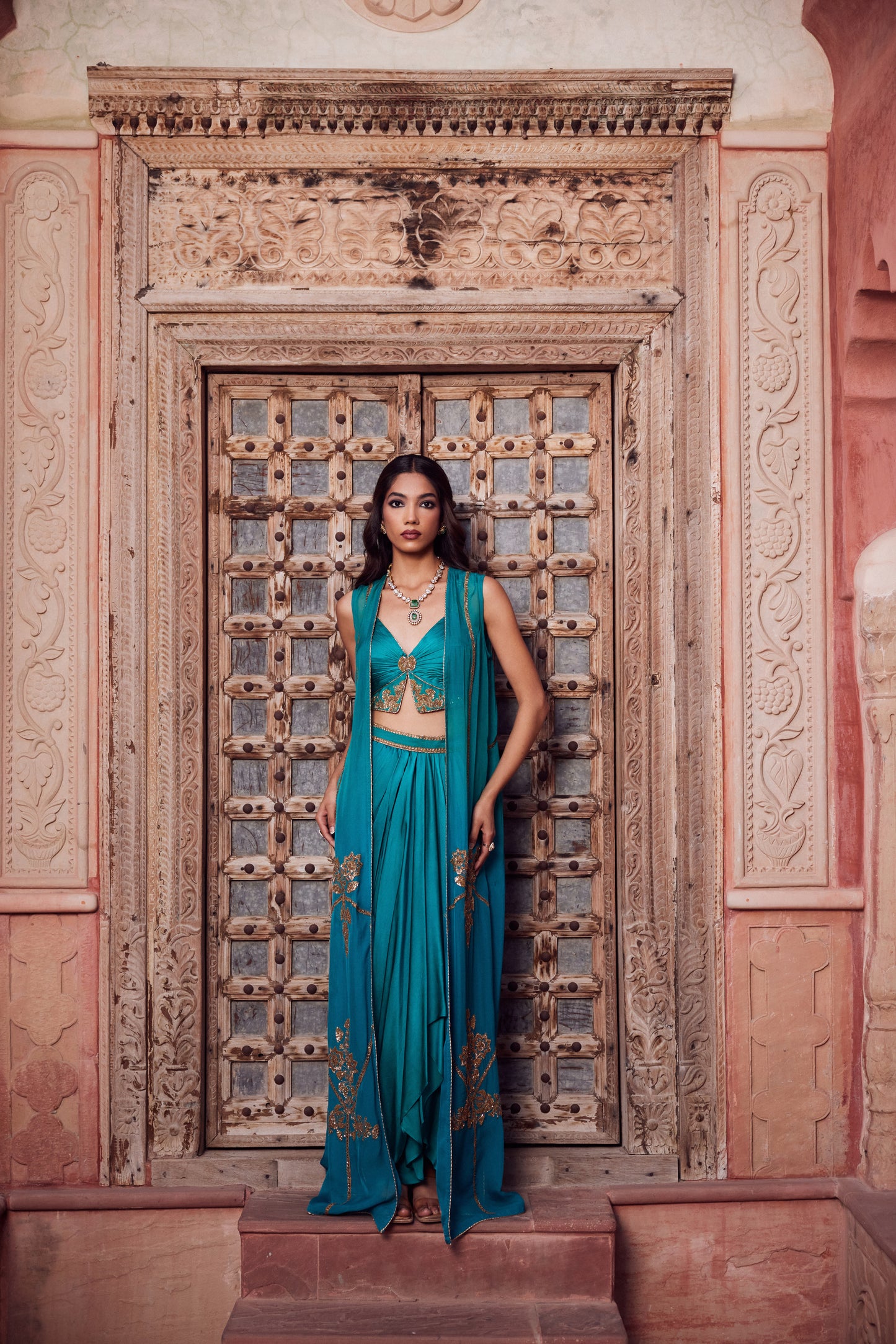 Teel turquise ombre organza georgette cape set with rooshing teel bustier and satin georgette drape skirt.