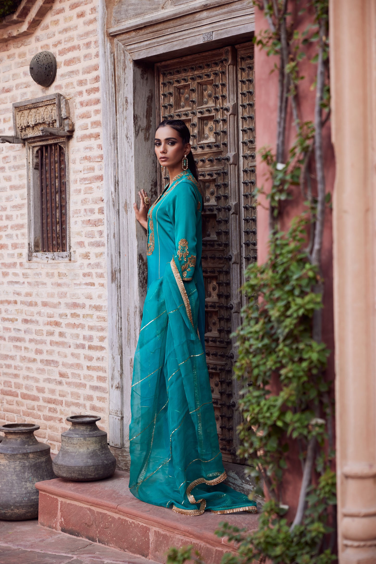 Teel turquoise ombre dyed satin georgette kurta set with organza dupatta and satin georgette pants.