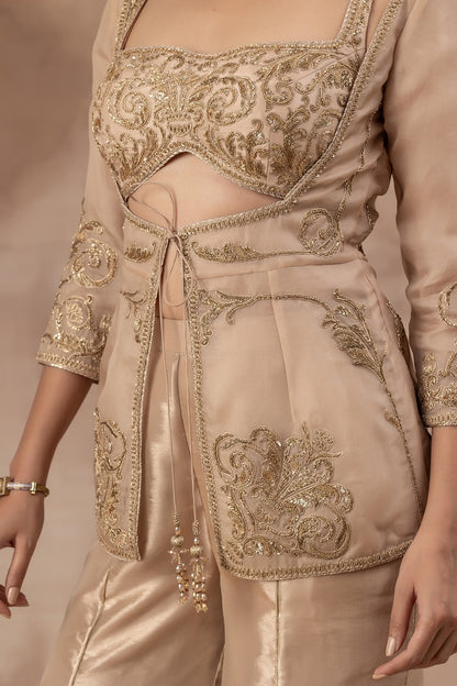 Beige gold silk bustier set with flare tissue flare panel pants and organza jacket