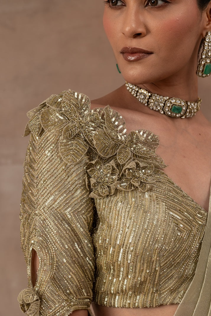 Metal green tissue drape sari with frills combined with blouse and waist belt