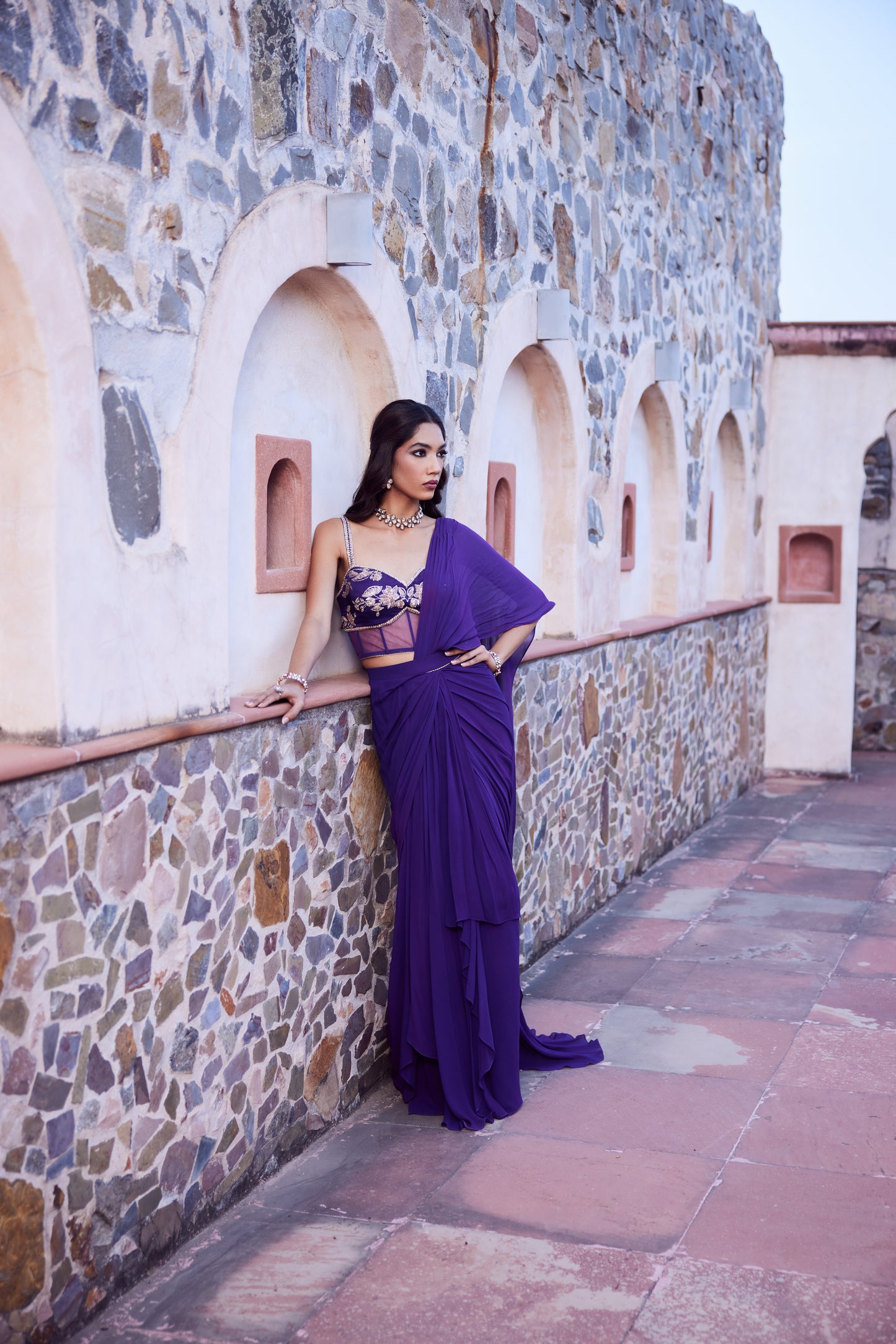 Purple ombre georgette pre stitched drape sari with a corset blouse in satin georgette.