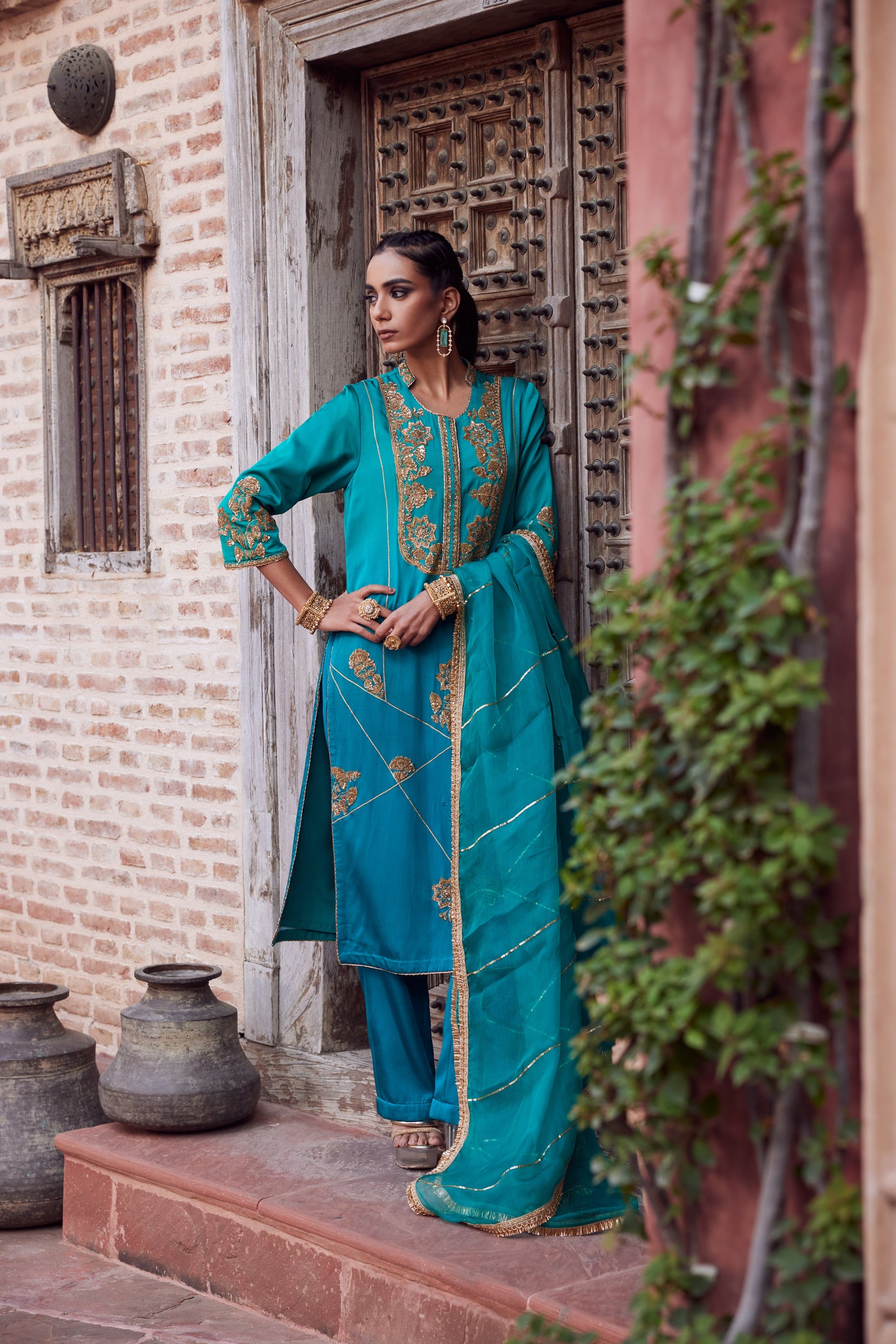 Teel turquoise ombre dyed satin georgette kurta set with organza dupatta and satin georgette pants.