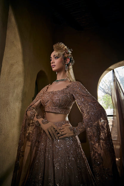 Dusty gold silk tissue lehnga set with cape sleeve blouse