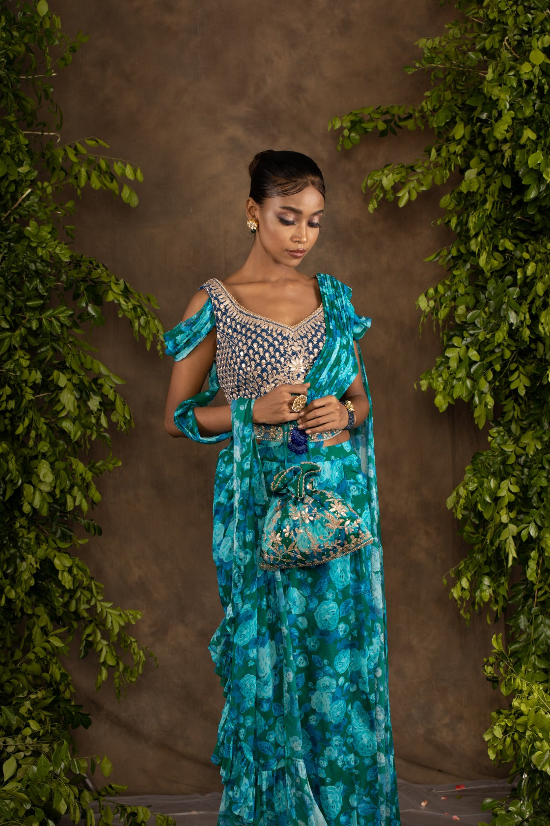 Blue floral printed drape saree with navy blue raw silk blouse