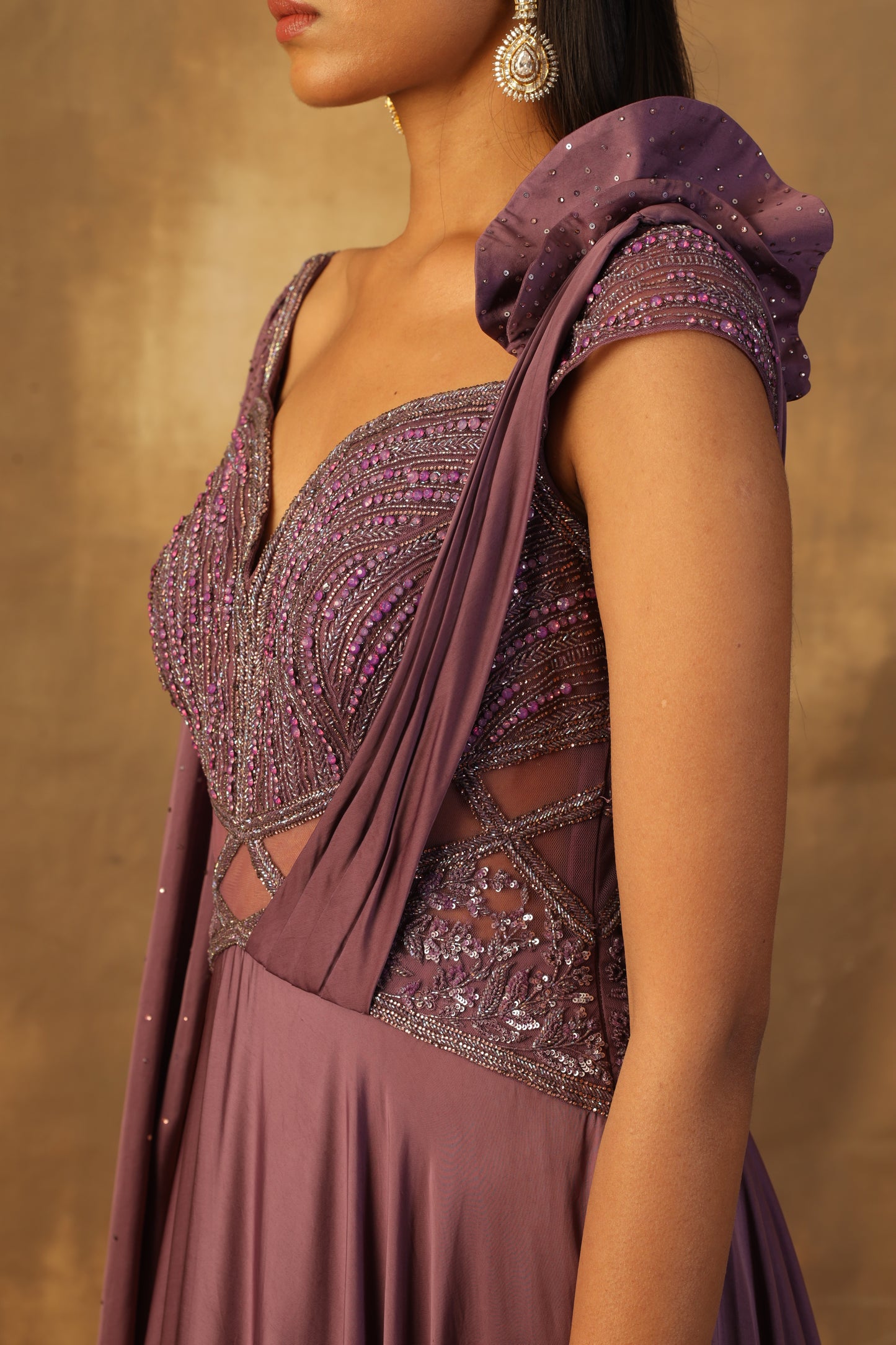 Purple modal satin gown with sequin and crystal embroidery combined with glass beads