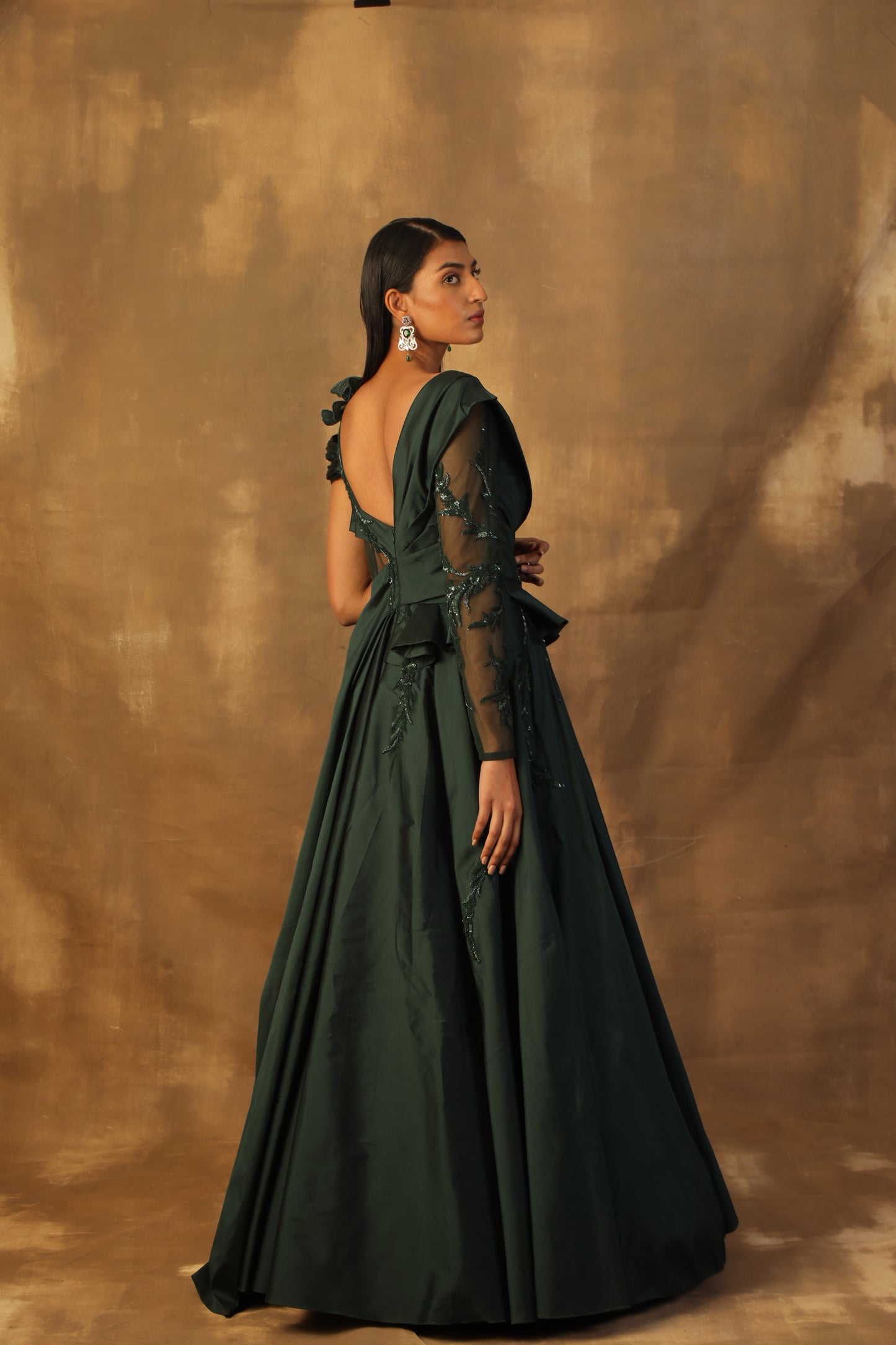 Bottle green tafeta gown embroidered with sequin and beads