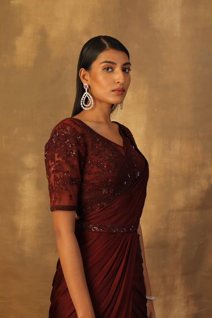 Wine drape lehnga sari with net blouse embroidered with dori and sequins