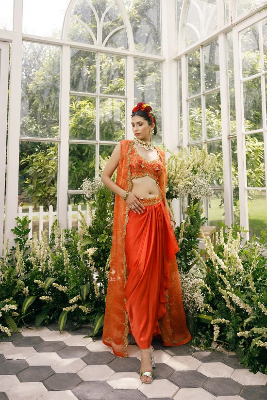 Silk blouse with silk tissue cape and irish satin drape skirt.