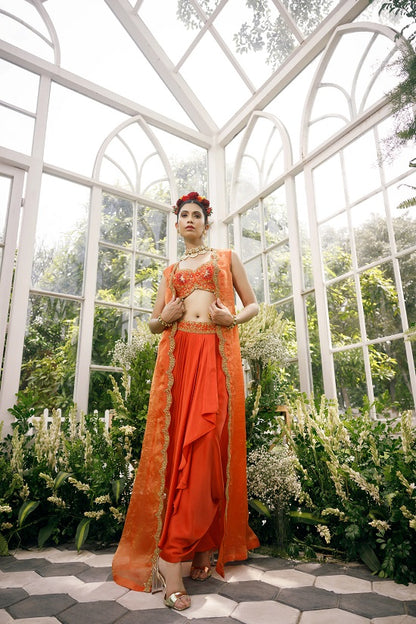Silk blouse with silk tissue cape and irish satin drape skirt.