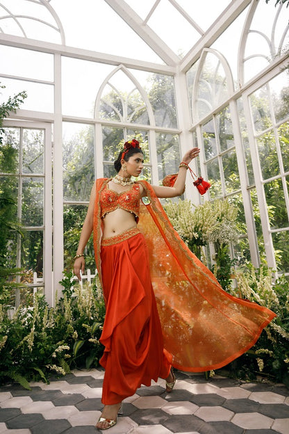 Silk blouse with silk tissue cape and irish satin drape skirt.